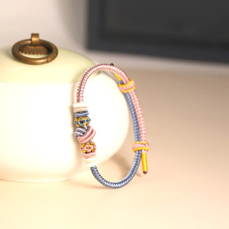 Handcrafted Two-Color Peace Knot Red String Bracelet - Image 6