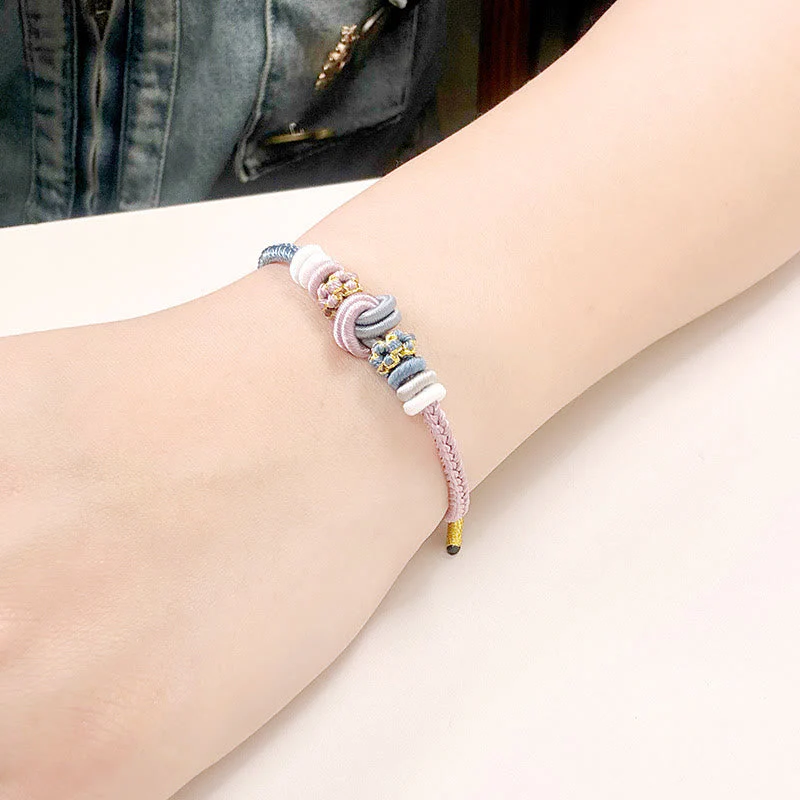 Handcrafted Two-Color Peace Knot Red String Bracelet - Image 7