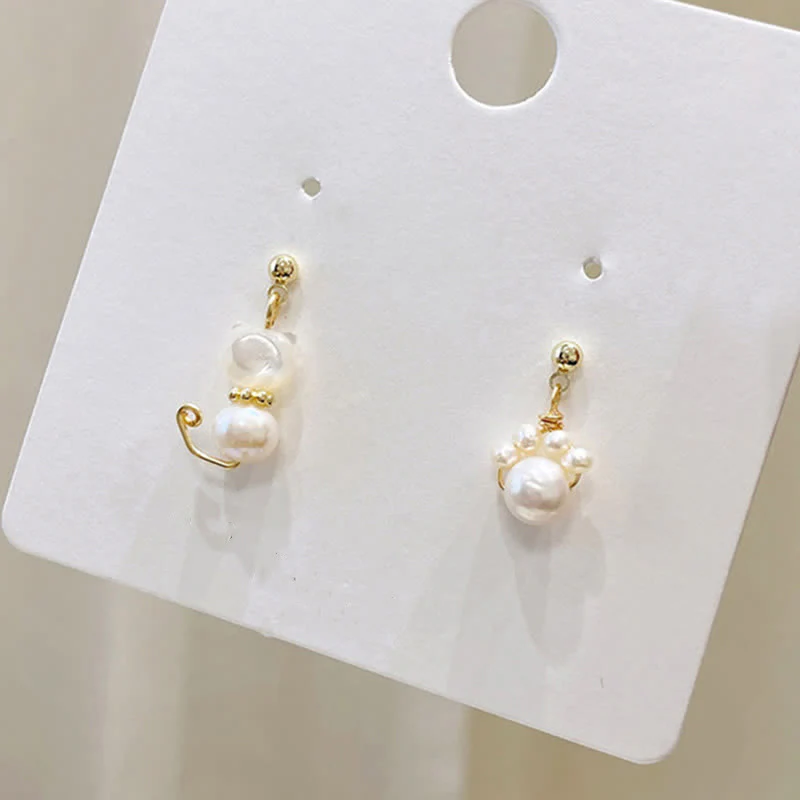 Pearl Wisdom Stud Earrings with Cat Paw Design - Image 8
