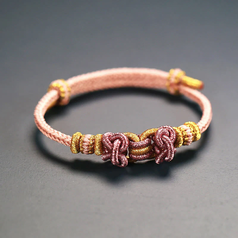 Unisex Red String Saddle Knot Strength Bracelet - Image 5